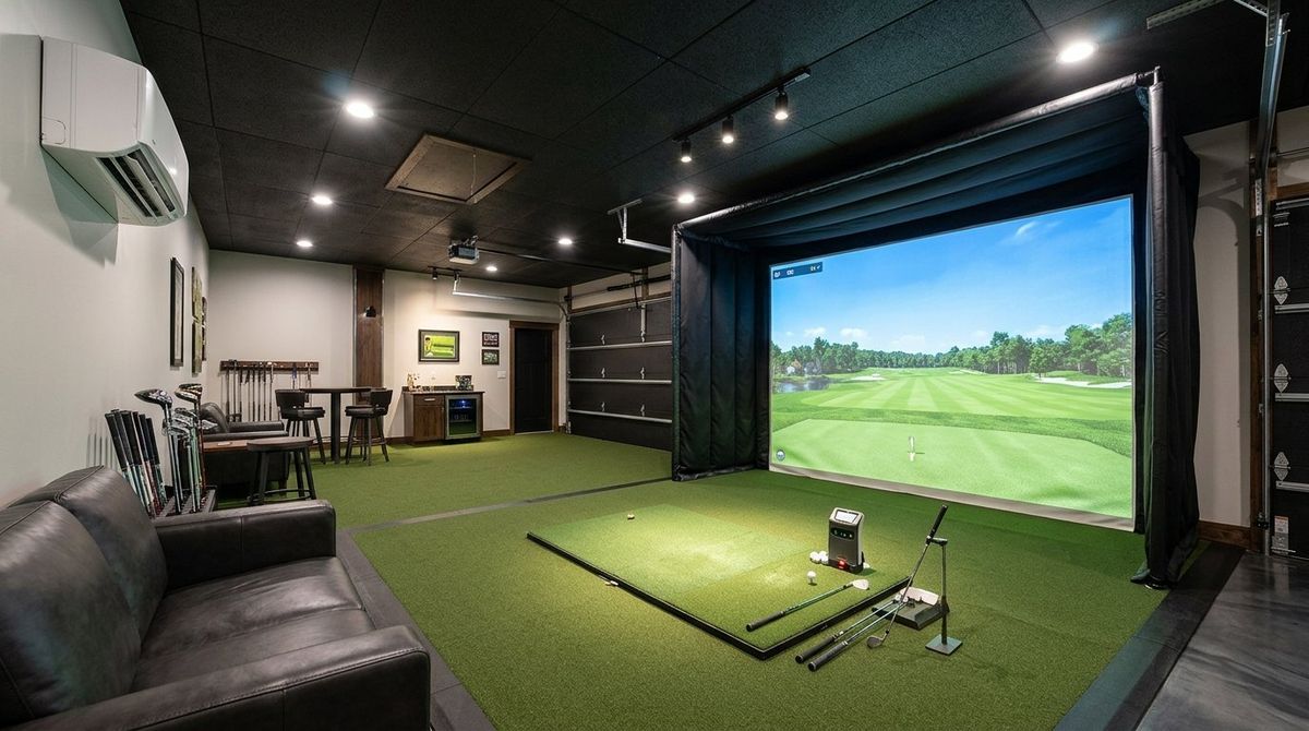 Insulated 20x20 garage golf simulator studio with 18,000 BTU wall-mounted inverter mini-split HVAC and 50 pint/day dehumidifier